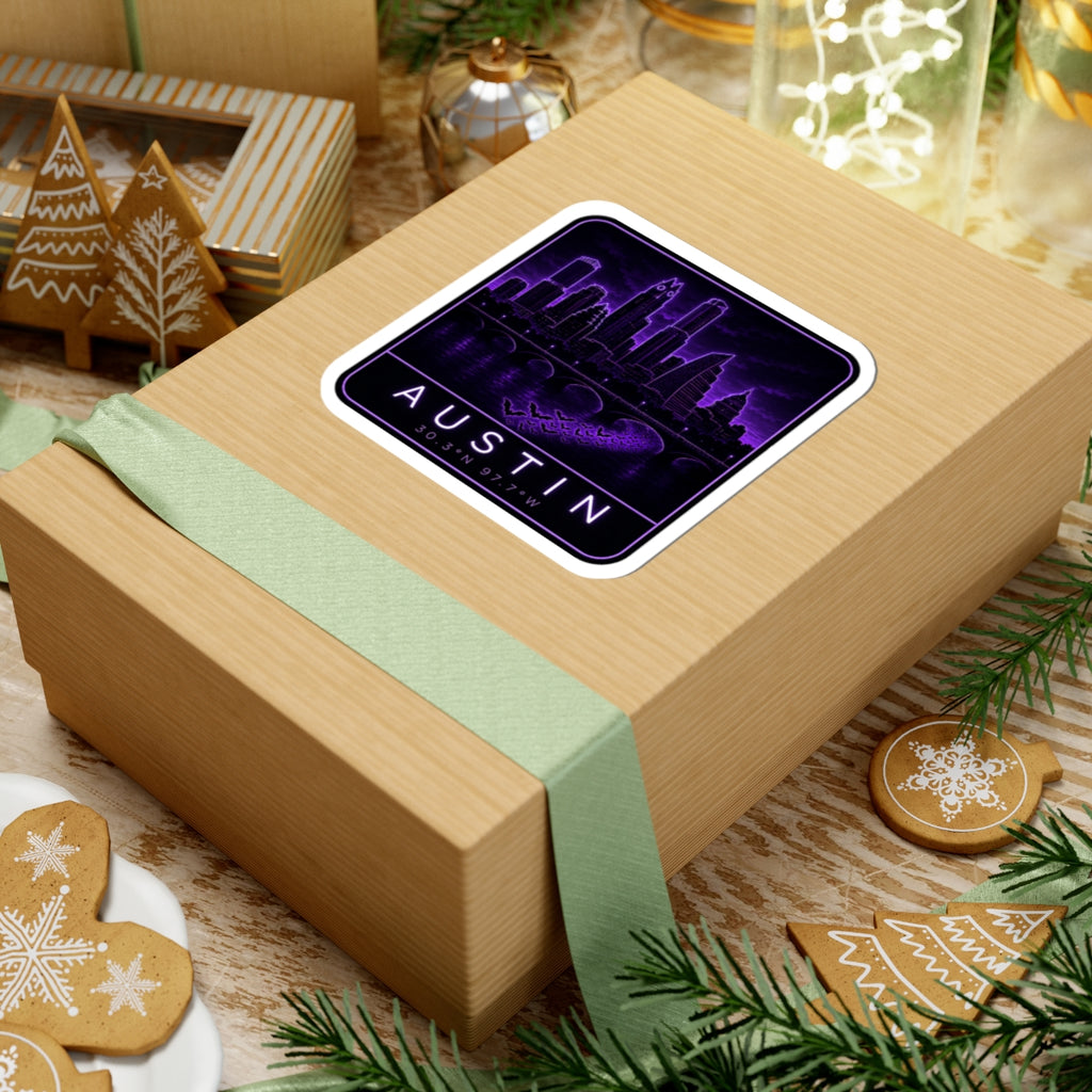 Neon Austin skyline sticker on wrapped box; purple neon border, “AUSTIN” and coordinates