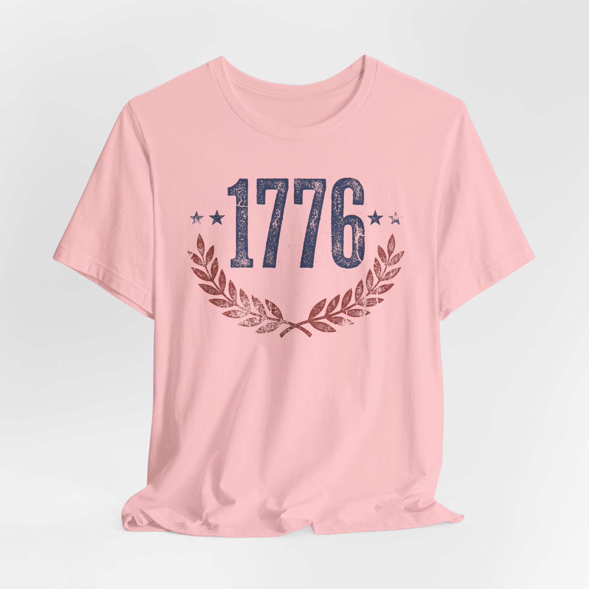 Pink t-shirt with 1776 laurel wreath graphic at center chest