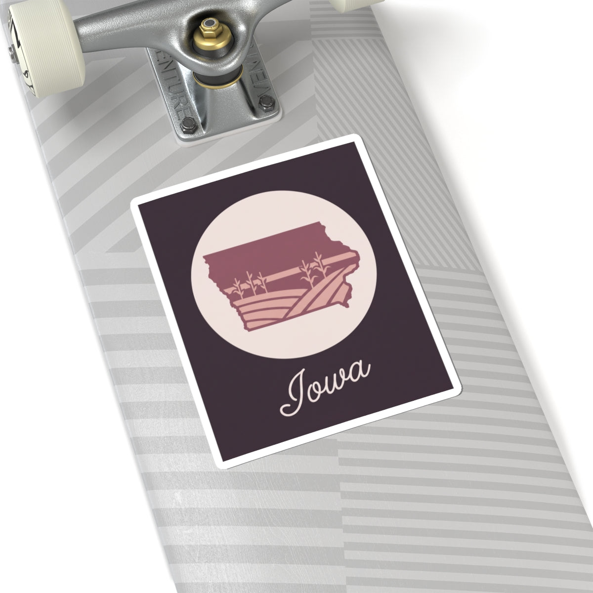 Mauve Iowa state silhouette kiss-cut sticker with “Iowa” script, pale circle, square bordered design