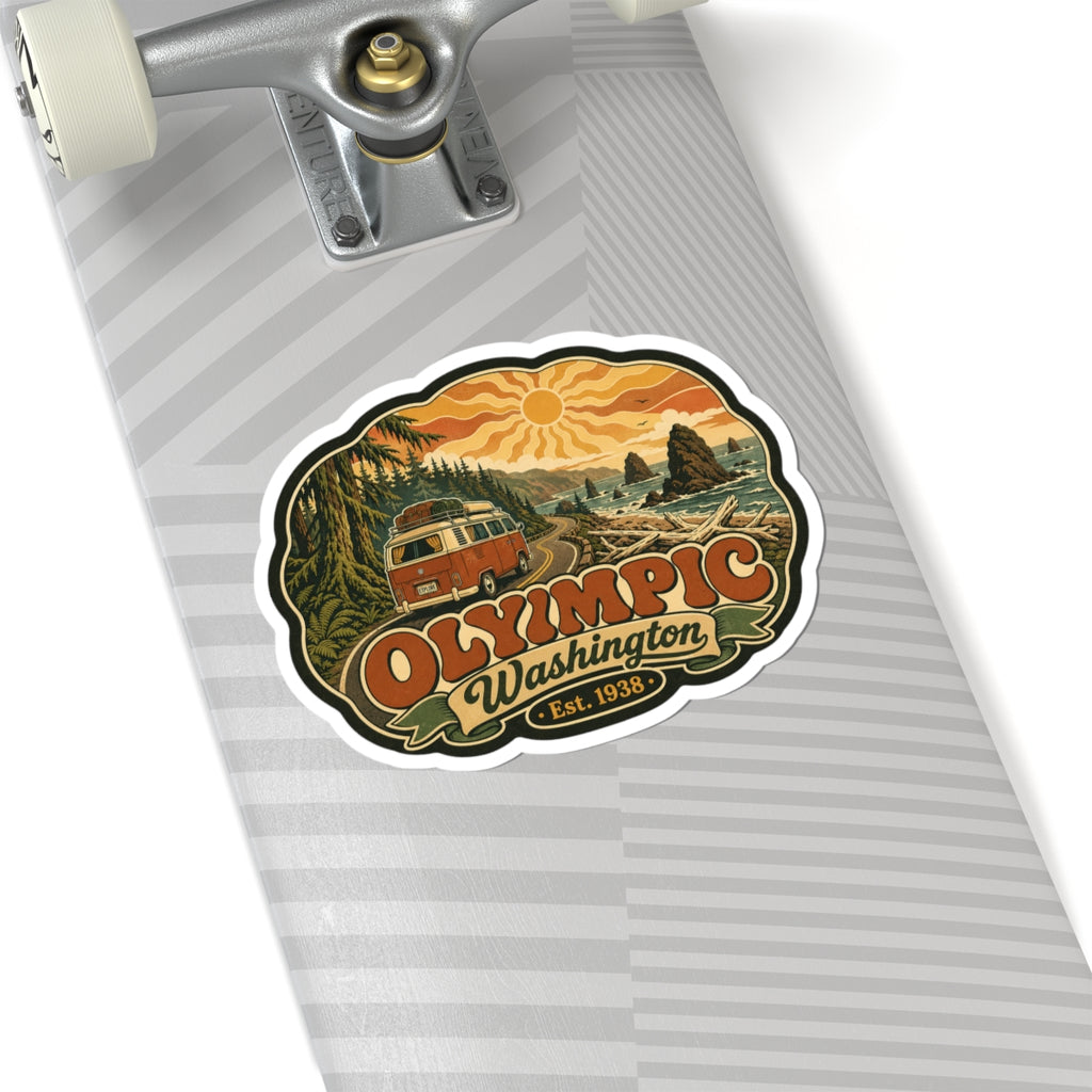 Die-cut sticker: vintage camper on road beside ocean waves, “Olympic Washington”, Est. 1938