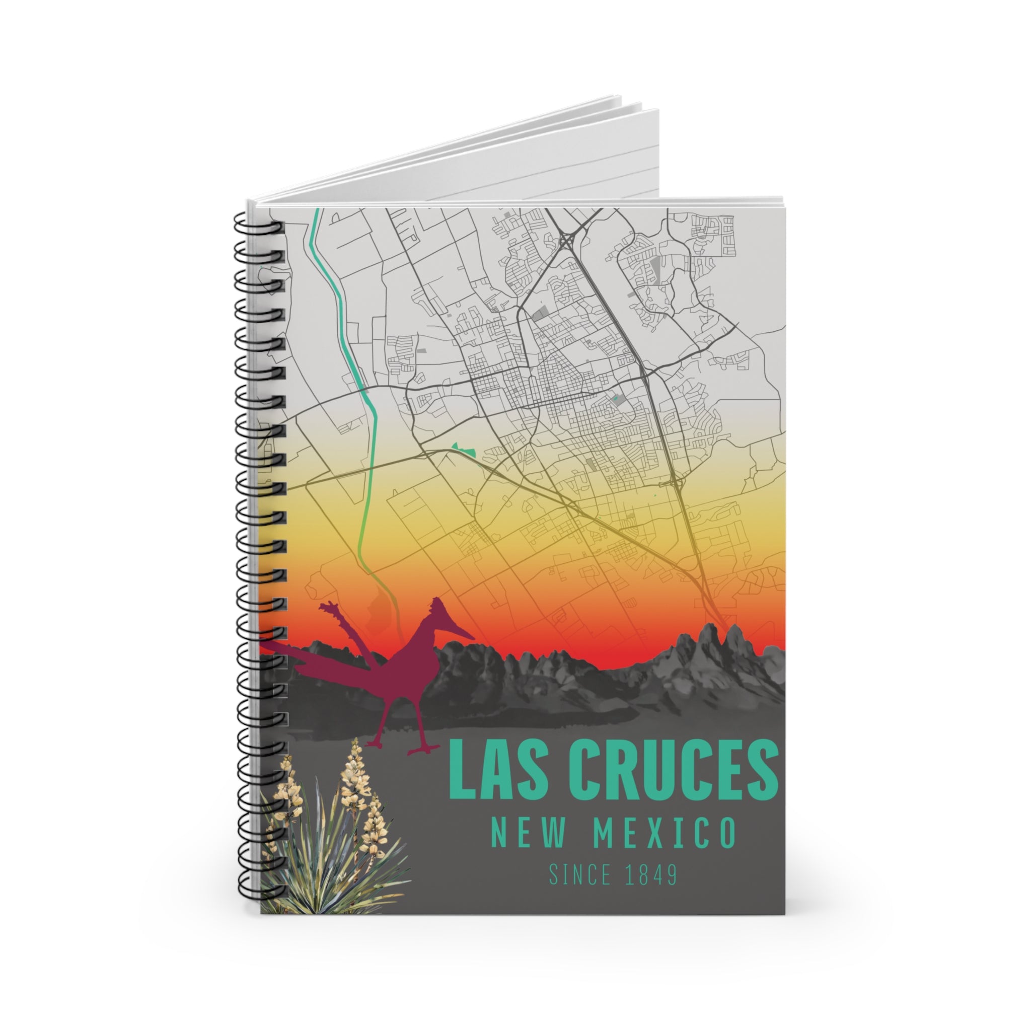 Las Cruces New Mexico spiral notebook with sunset map cover and visible stacked pages