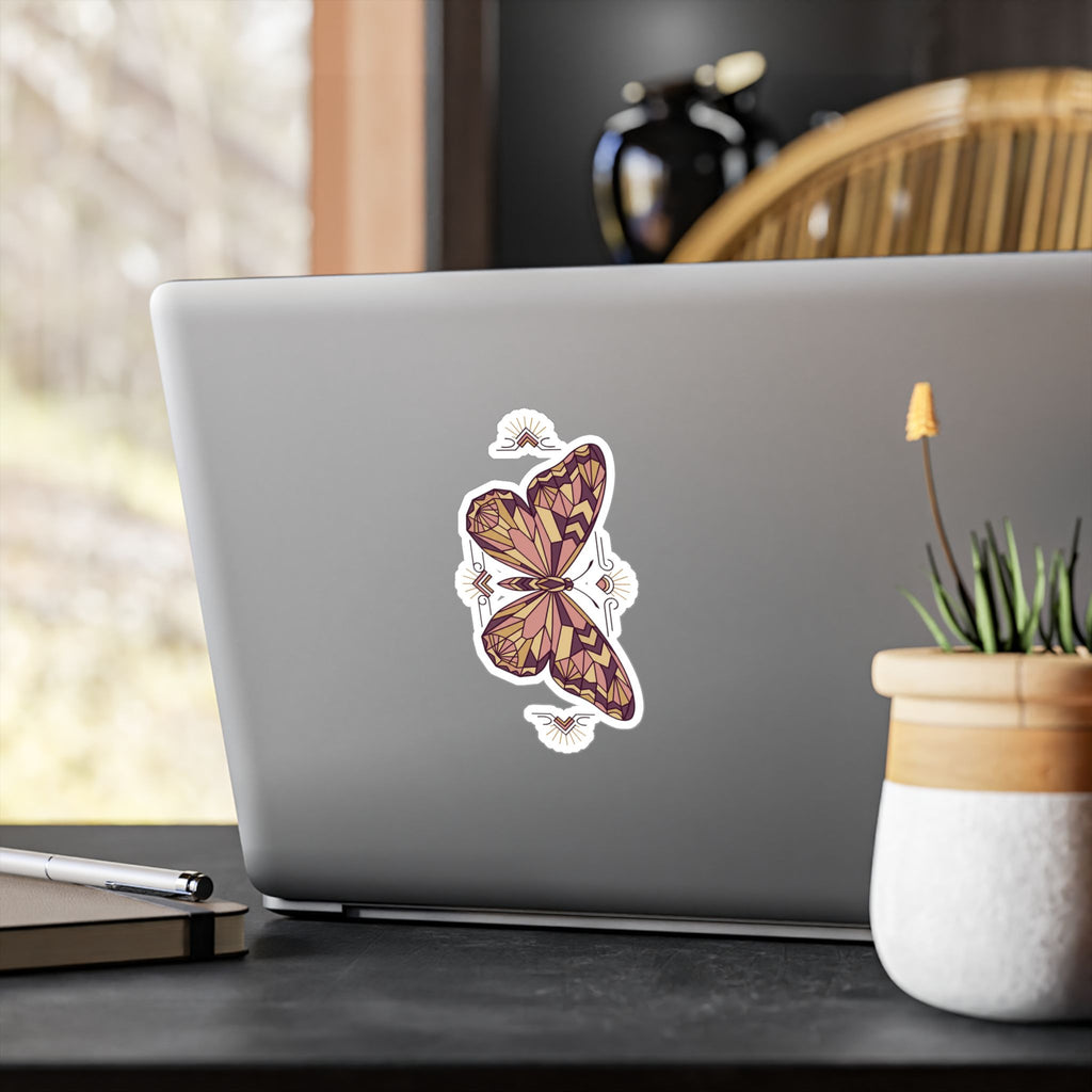 Geometric butterfly vinyl decal sticker on laptop lid, purple-pink geometric wings with bow center