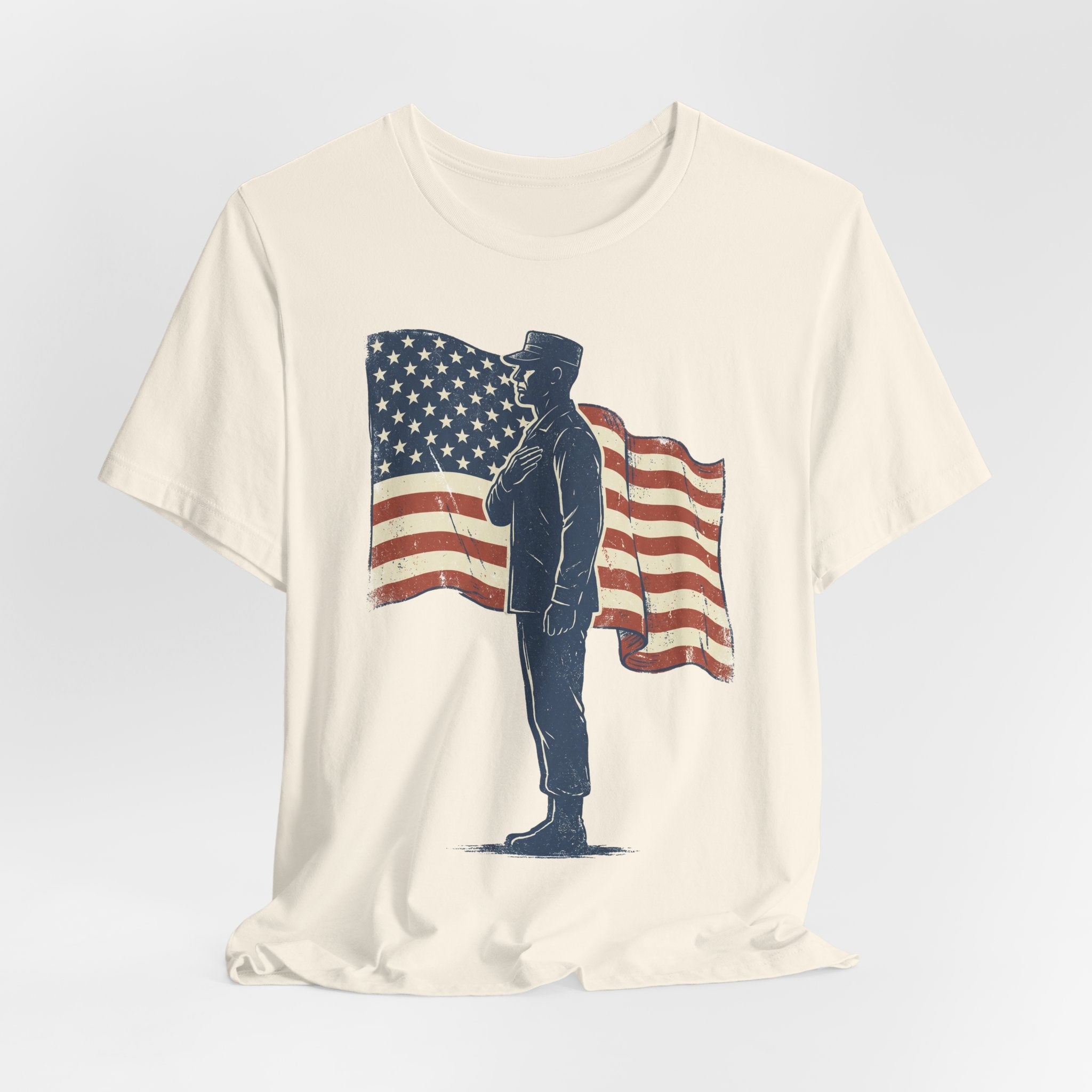 Cream T-shirt with full soldier silhouette standing in front of waving American flag