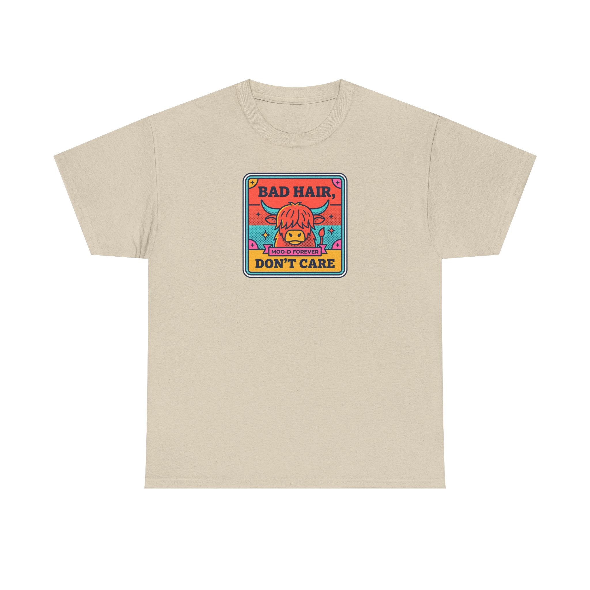Beige t-shirt with square cow graphic reading “Bad Hair Don’t Care”.