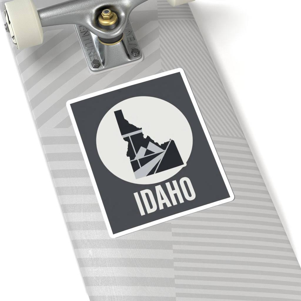 Idaho geometric map kiss-cut sticker, dark square with white circle, Idaho silhouette and IDAHO text