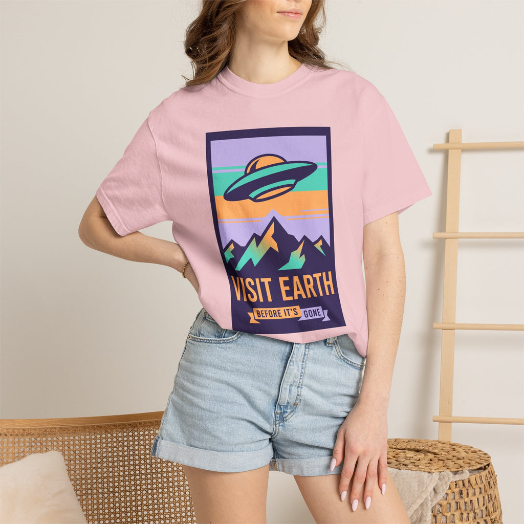 Pink crewneck T-shirt with UFO 'Visit Earth' graphic on front