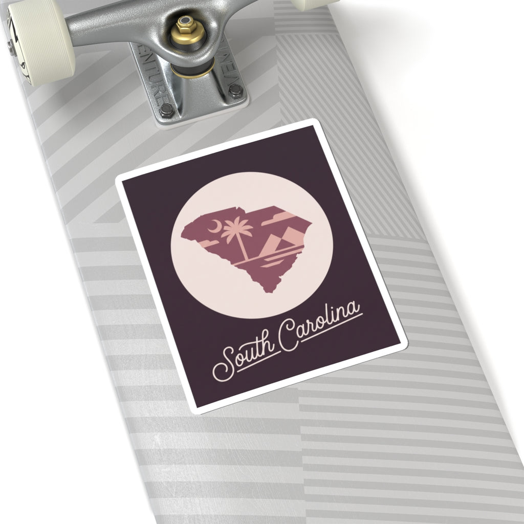 South Carolina sticker on a rolling suitcase with circular palm tree state design