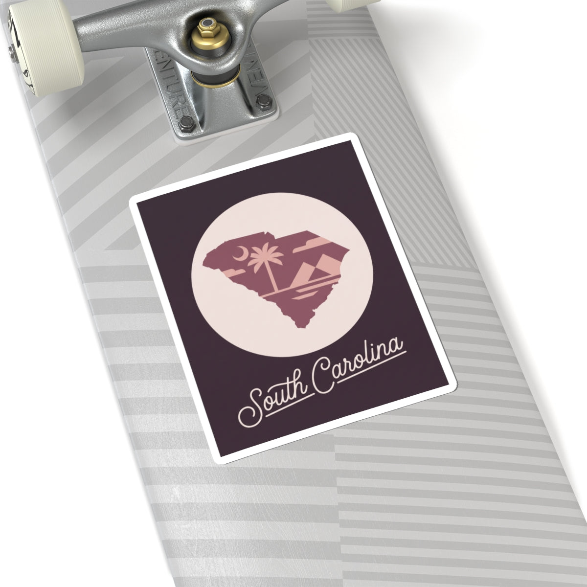 South Carolina sticker on a rolling suitcase with circular palm tree state design