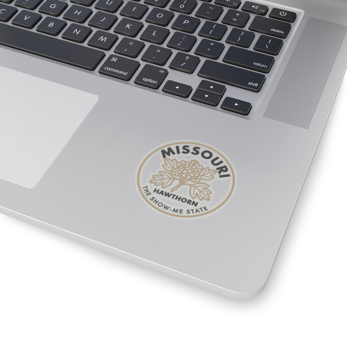 Transparent vinyl hawthorn state sticker on laptop lid, round seal with Missouri text