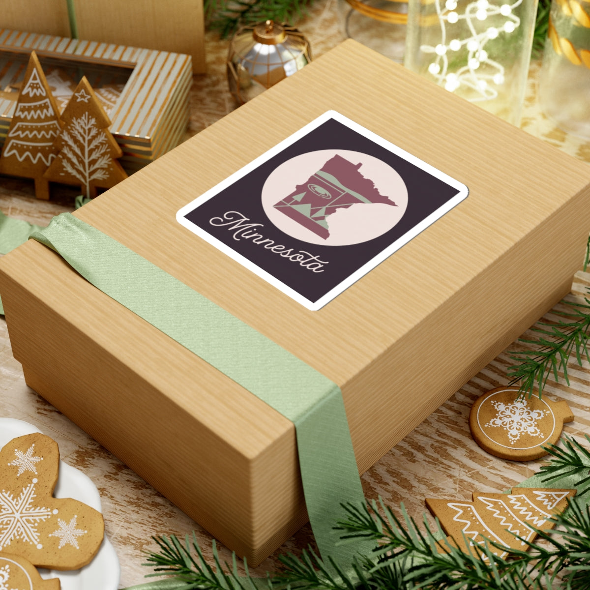 Minnesota sticker on wrapped present, state silhouette inside a circle with “Minnesota” script