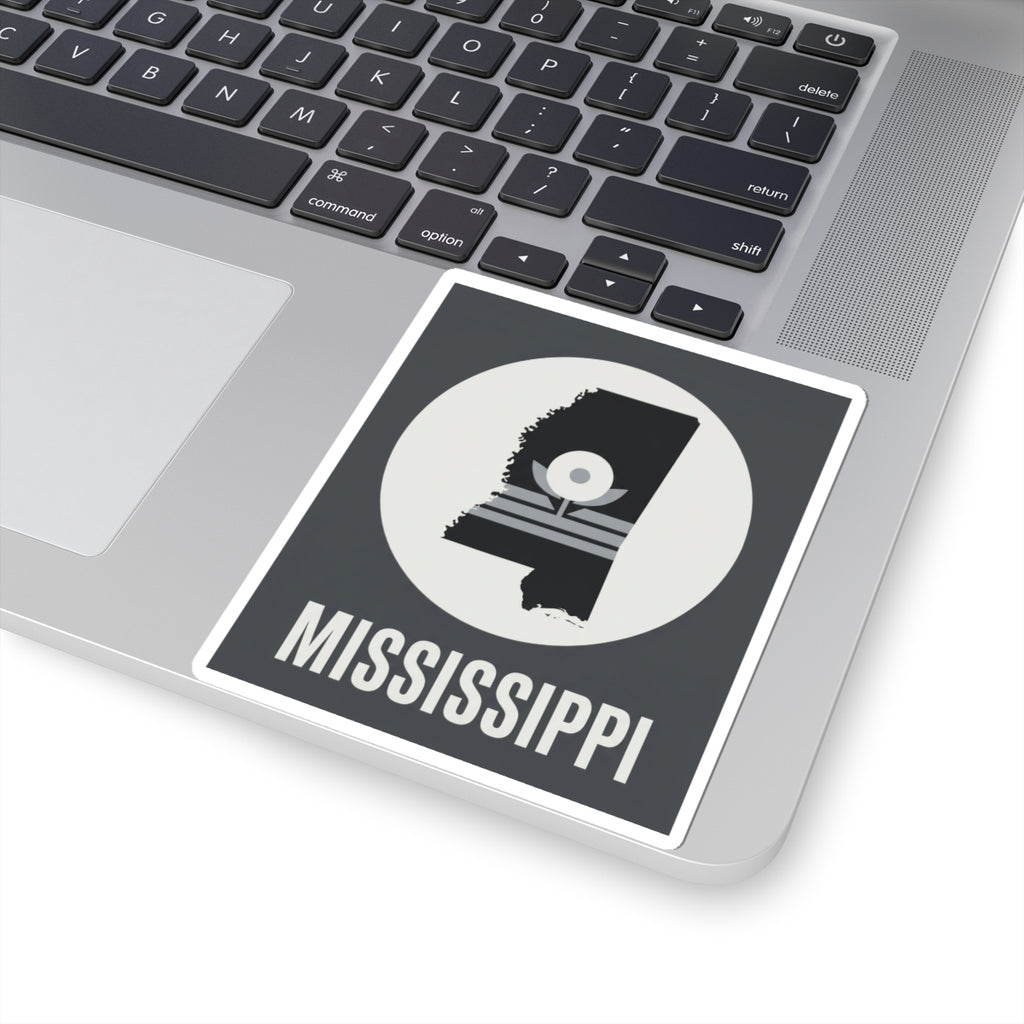 Mississippi silhouette sticker on laptop, bold “MISSISSIPPI” under circular emblem