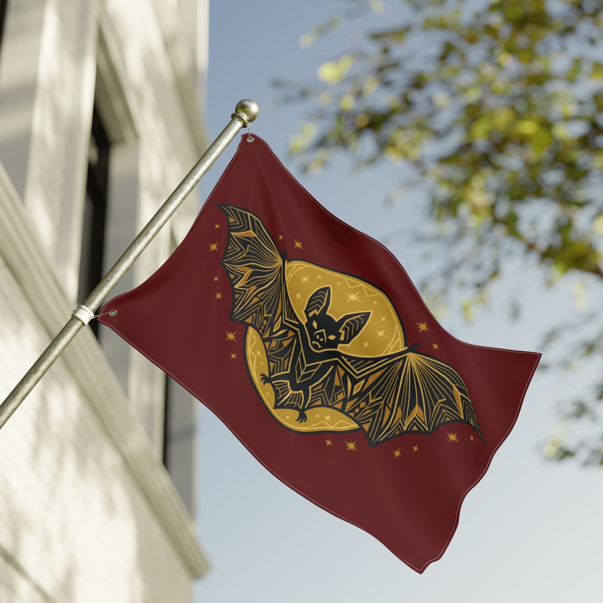 Burgundy geometric bat moon flag on pole, gold bat silhouette and moon circle