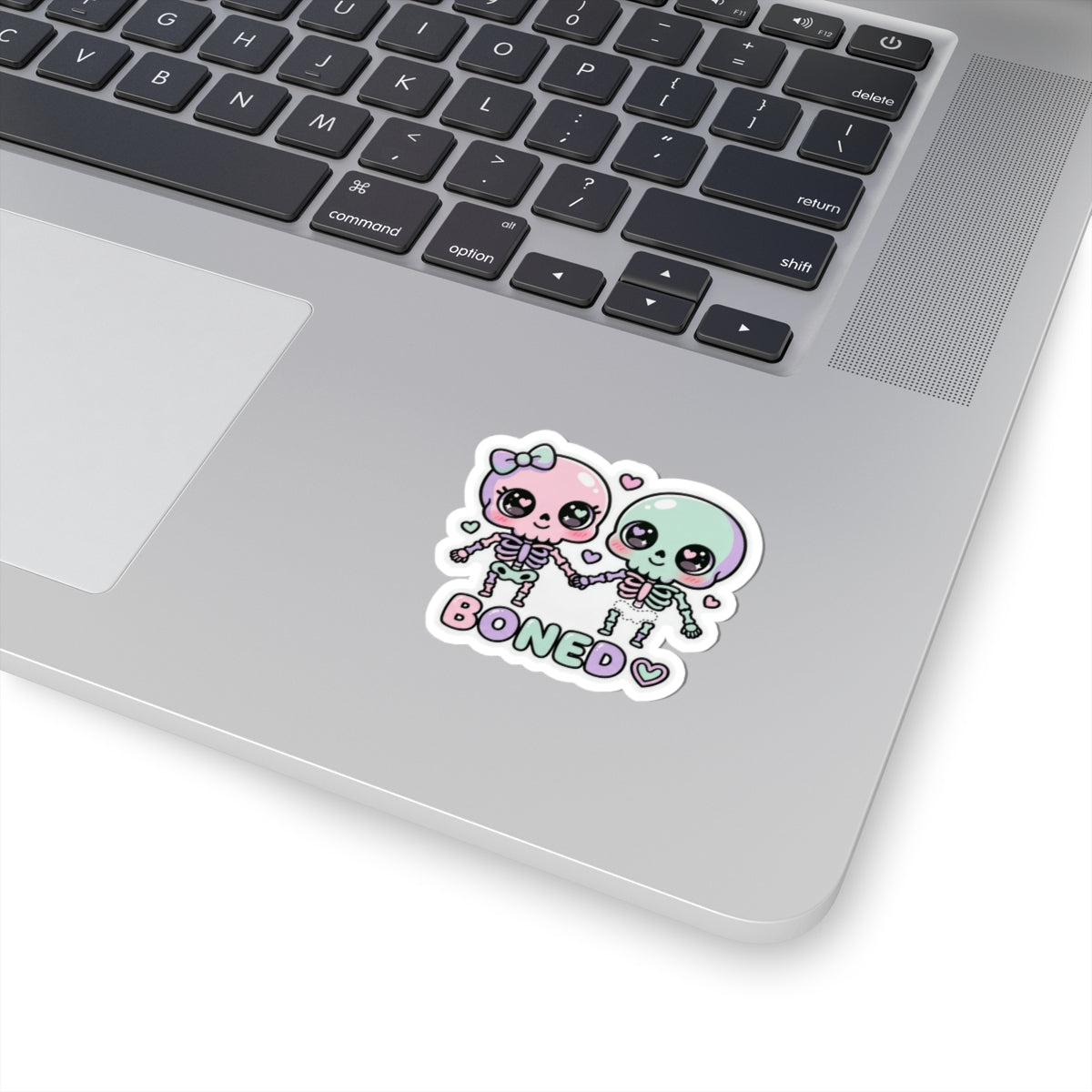 Pastel cute skeleton couple kiss kiss-cut sticker with “BONED” text, white outline
