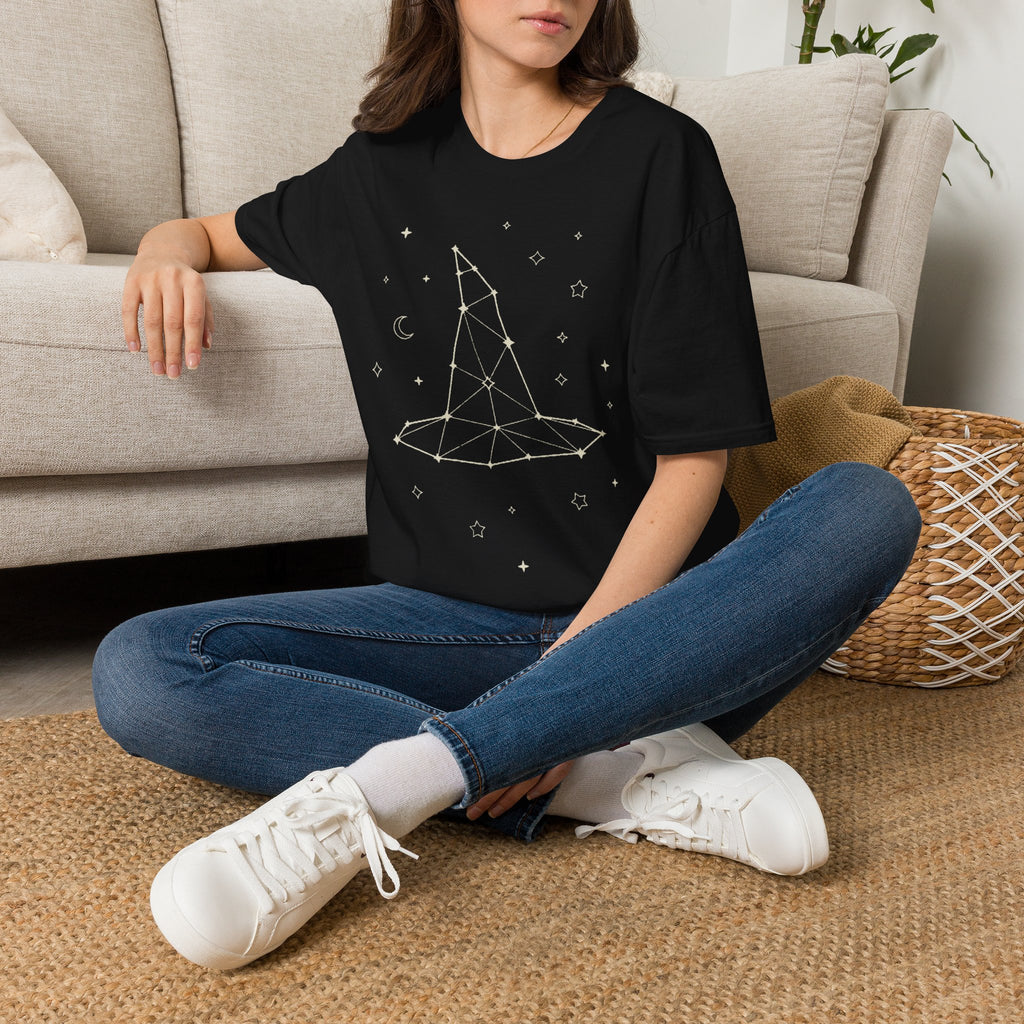 Black crewneck T-shirt with celestial constellation graphic and star icons, worn by model