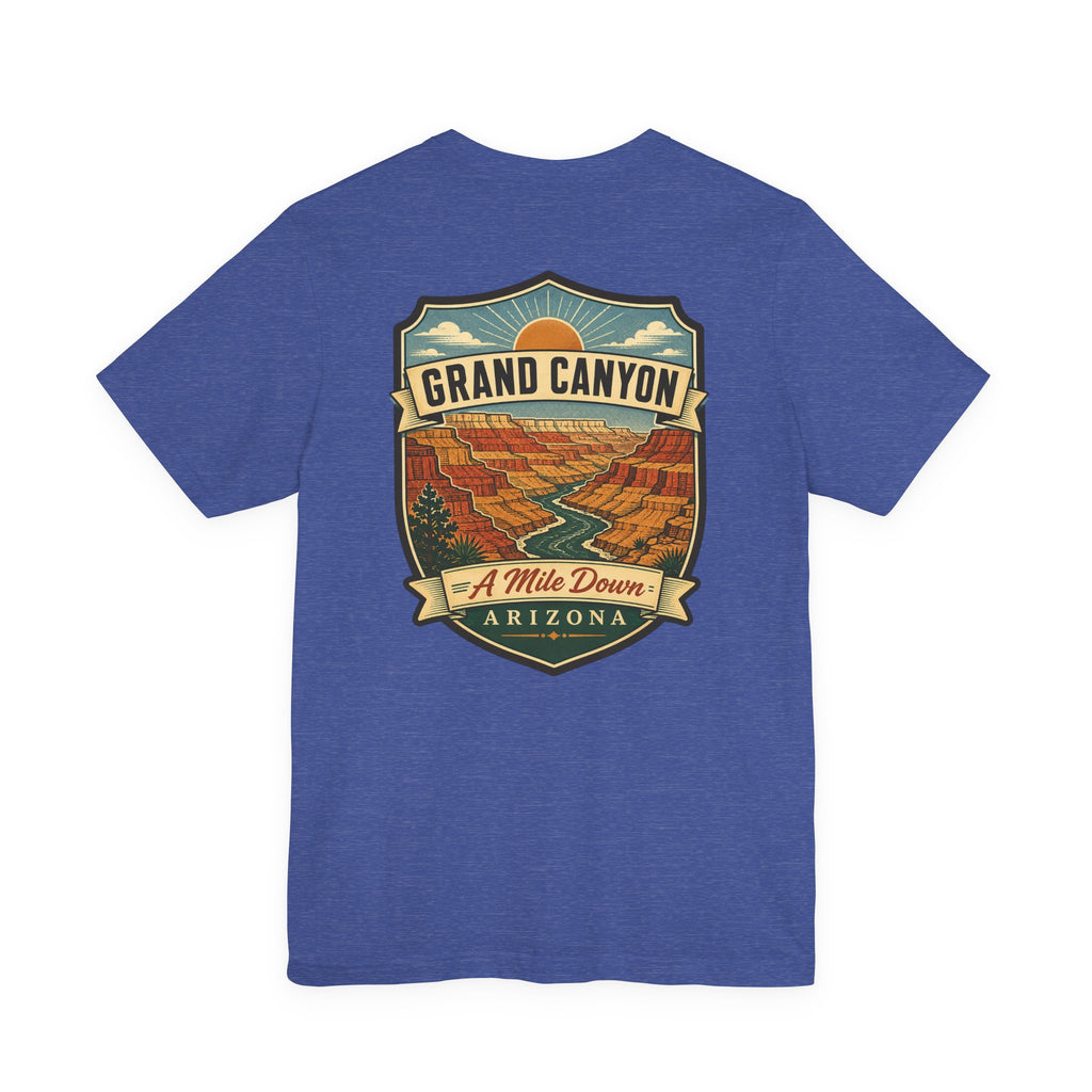 Blue crew-neck t-shirt with large Grand Canyon scenic graphic and banner text.