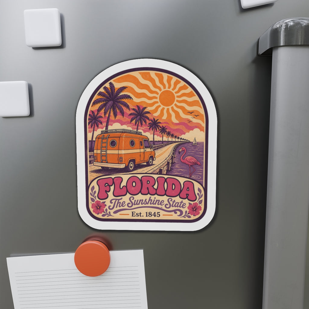 Die-cut Florida souvenir magnet on refrigerator with retro orange van, palm trees, and flamingo