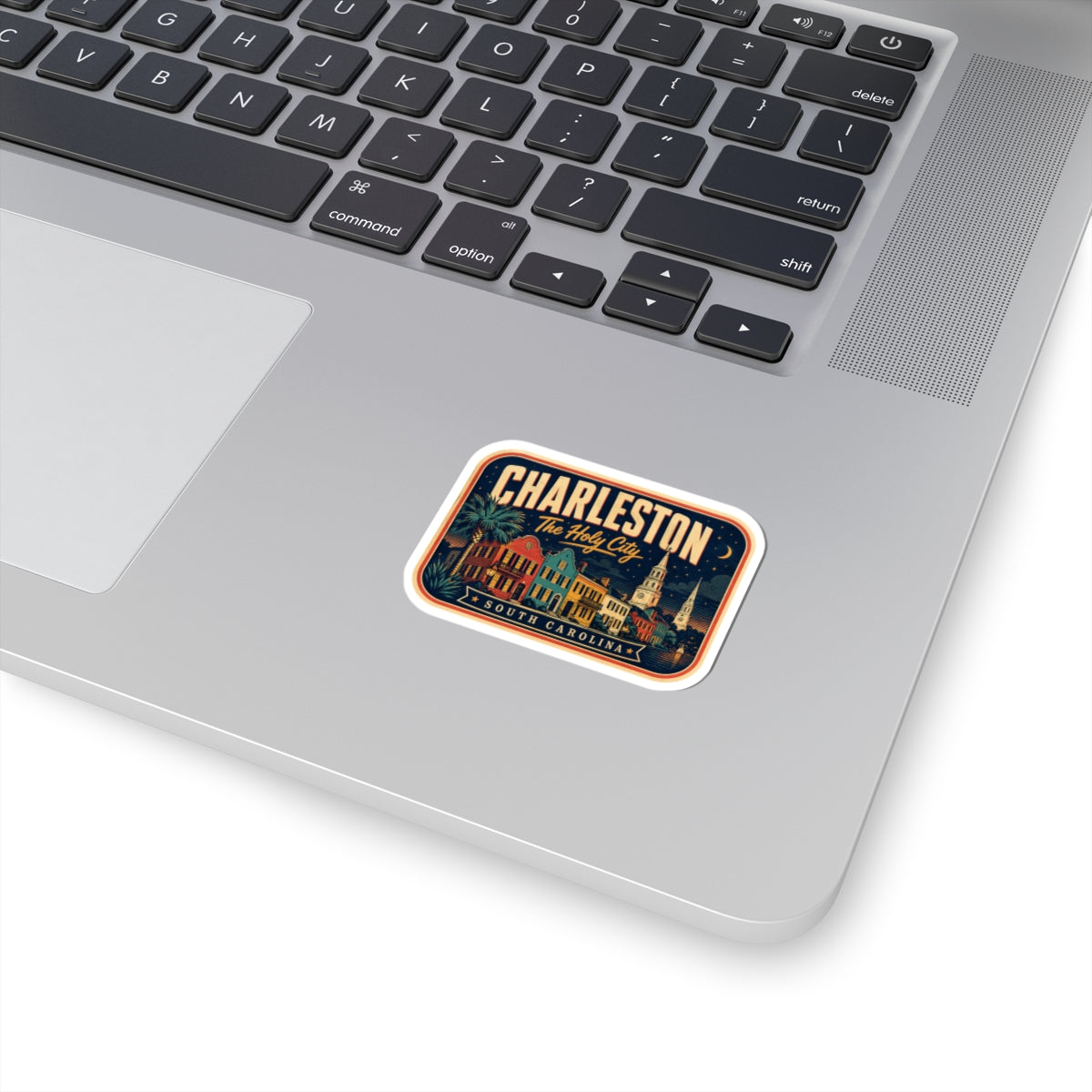 Charleston luggage tag sticker with retro city skyline and black border, on laptop