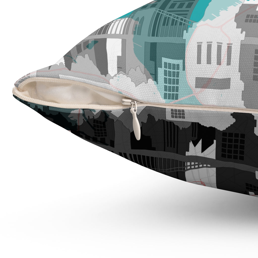 Throw pillow close-up: zipper edge on NYC map print, teal and gray skyline