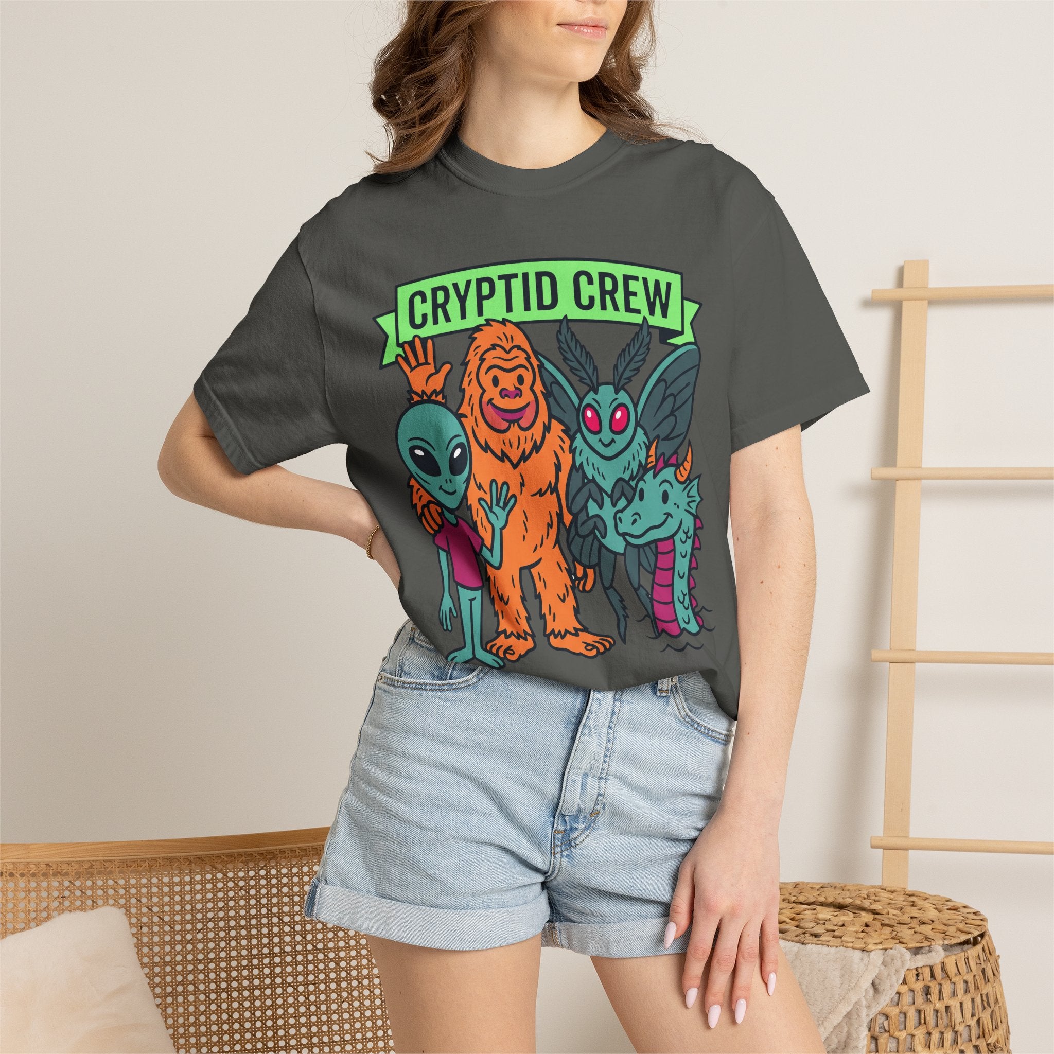 Dark gray crew-neck T-shirt with colorful “Cryptid Crew” graphic of four alien cryptids
