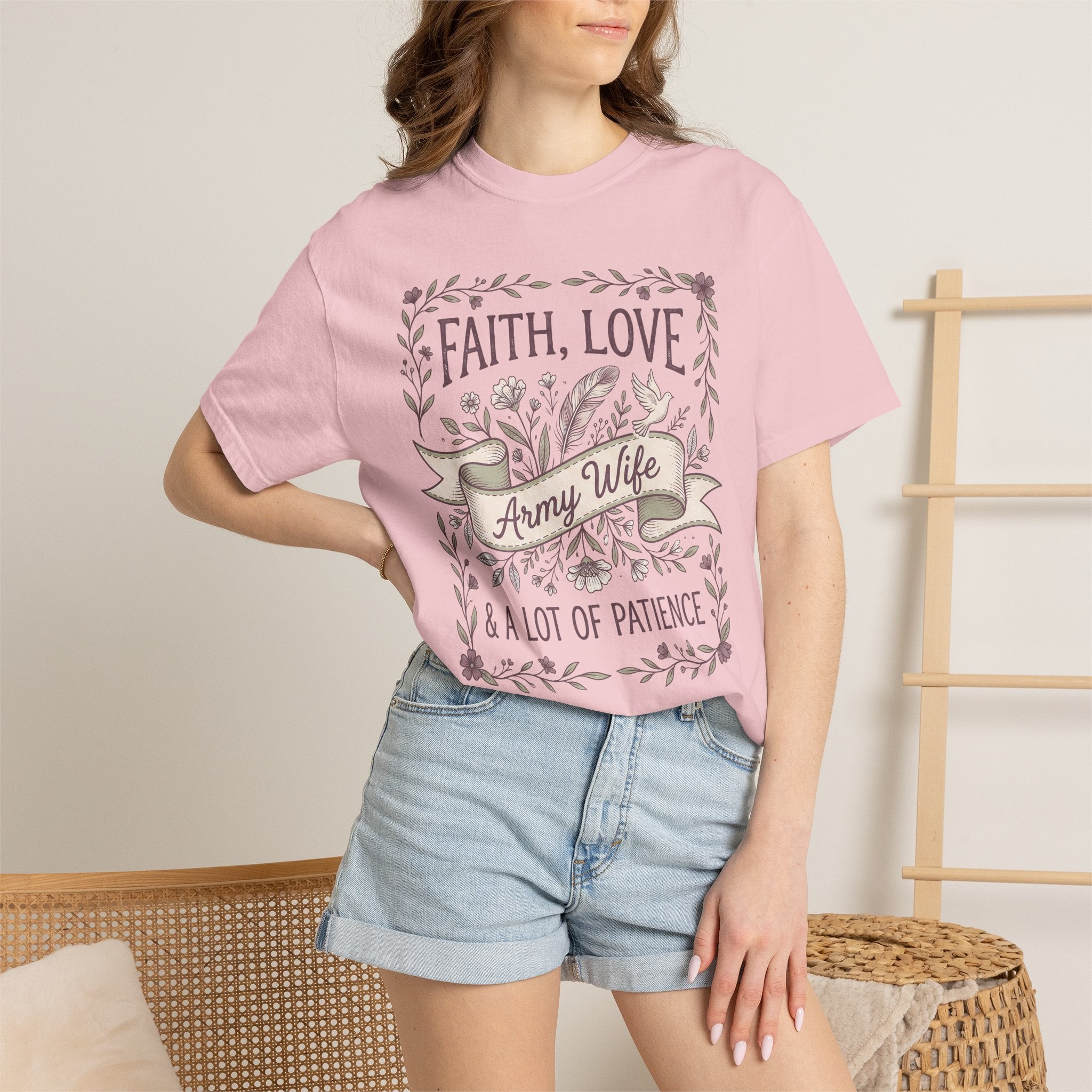 Pink crewneck T-shirt with floral 'Faith, Love' and ribbon 'Army Wife' front graphic.