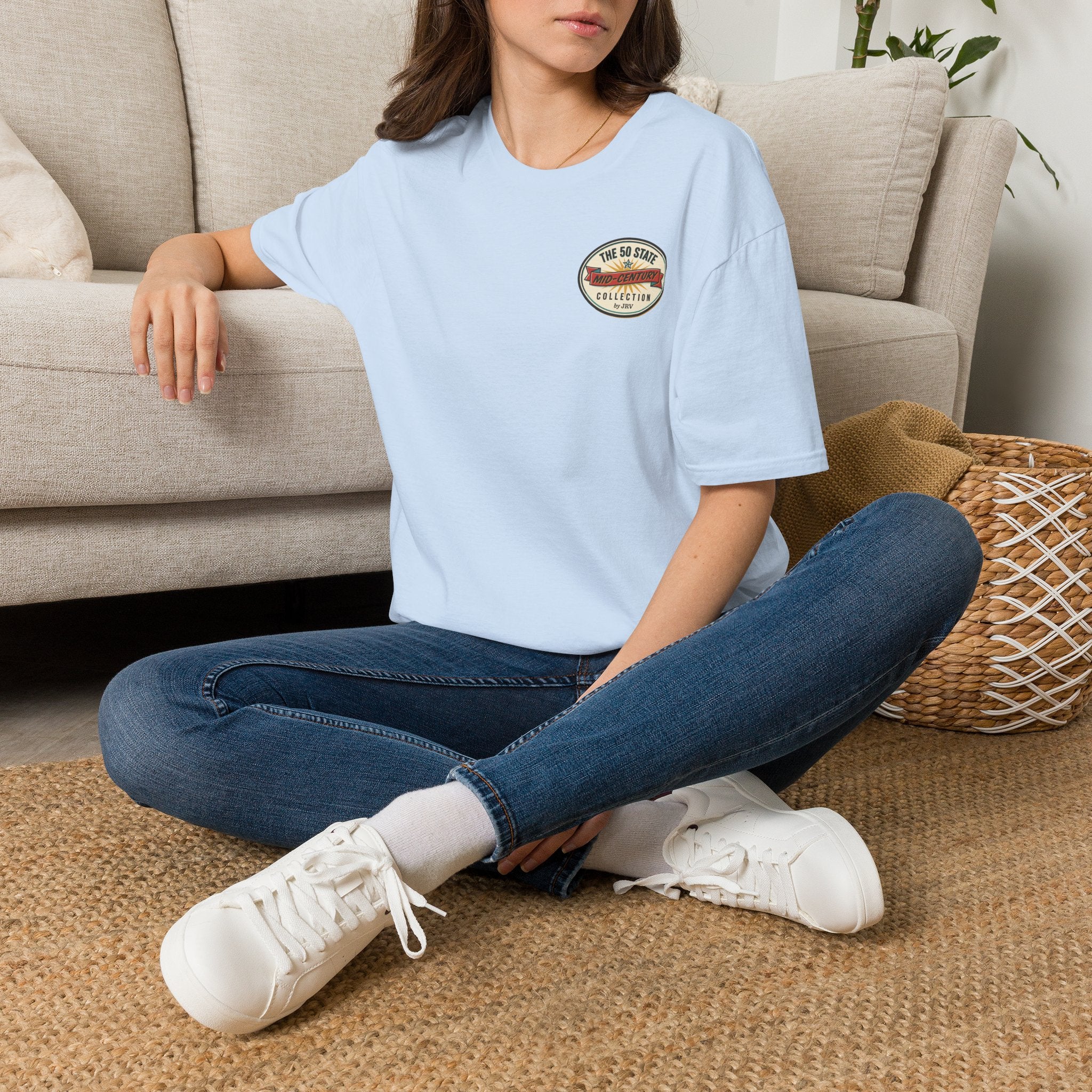 Light blue crewneck T-shirt with small circular chest patch logo