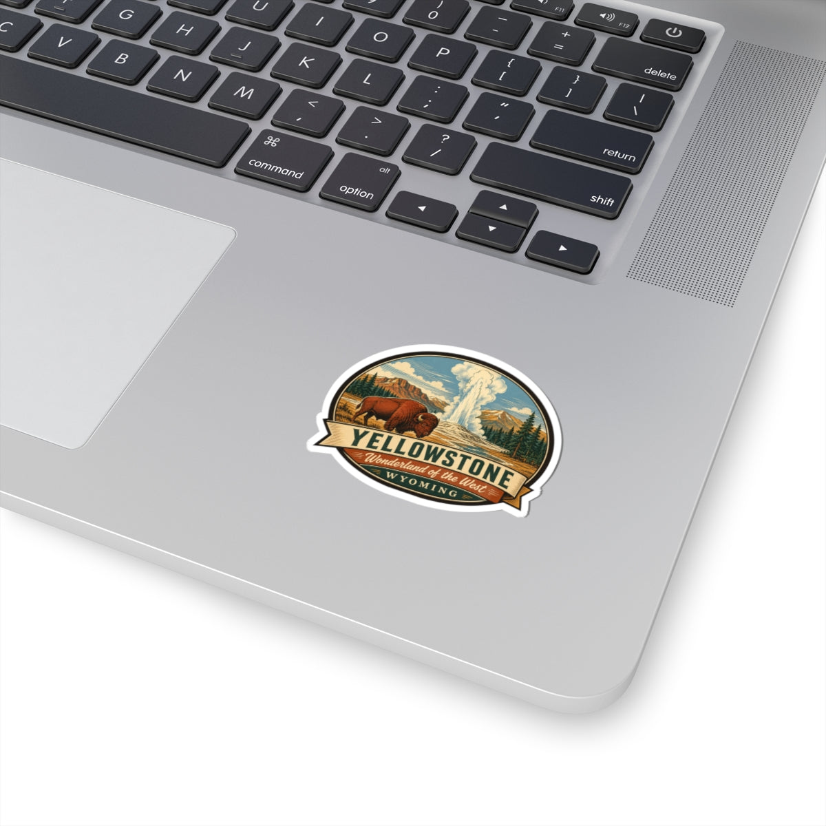 Travel sticker with vintage landscape badge design on a laptop