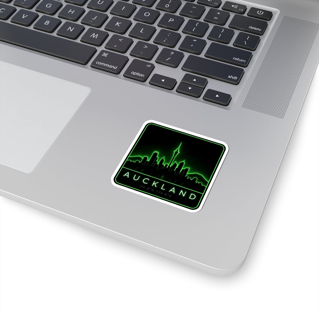 Neon green Auckland skyline kiss-cut vinyl sticker with black background and “AUCKLAND” text