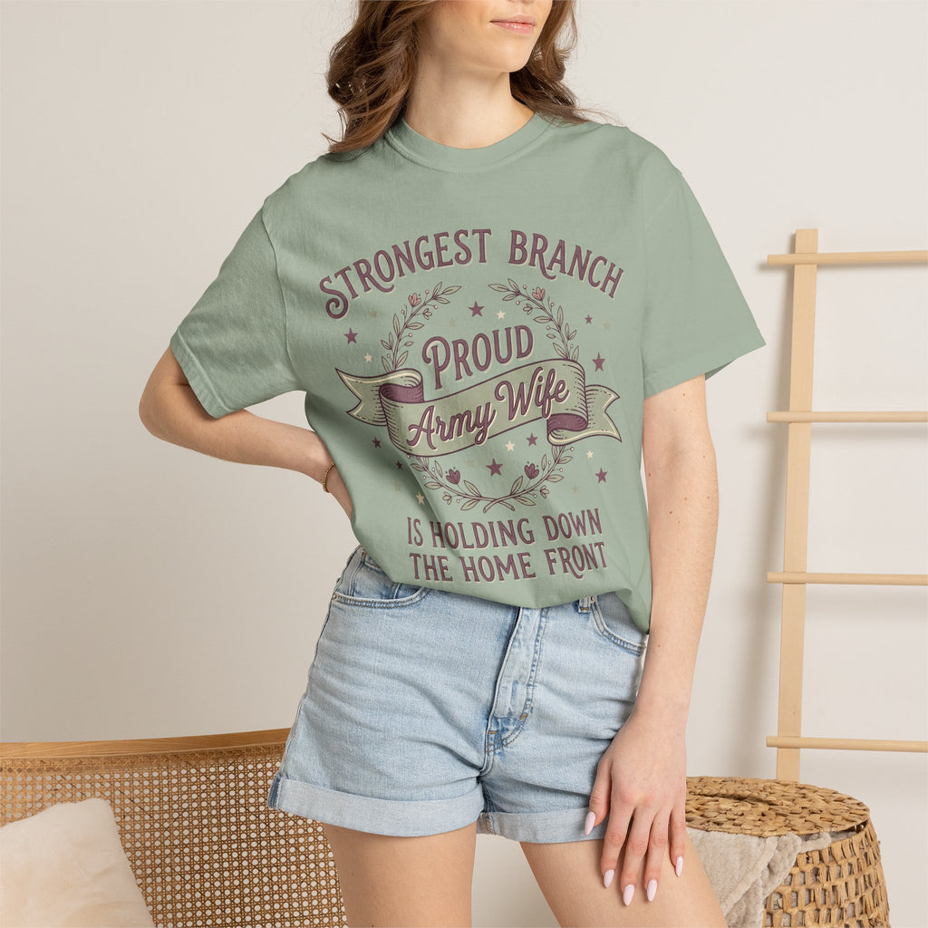 Green T-shirt worn by a model; round wreath graphic with “Proud Army Wife” and stars.