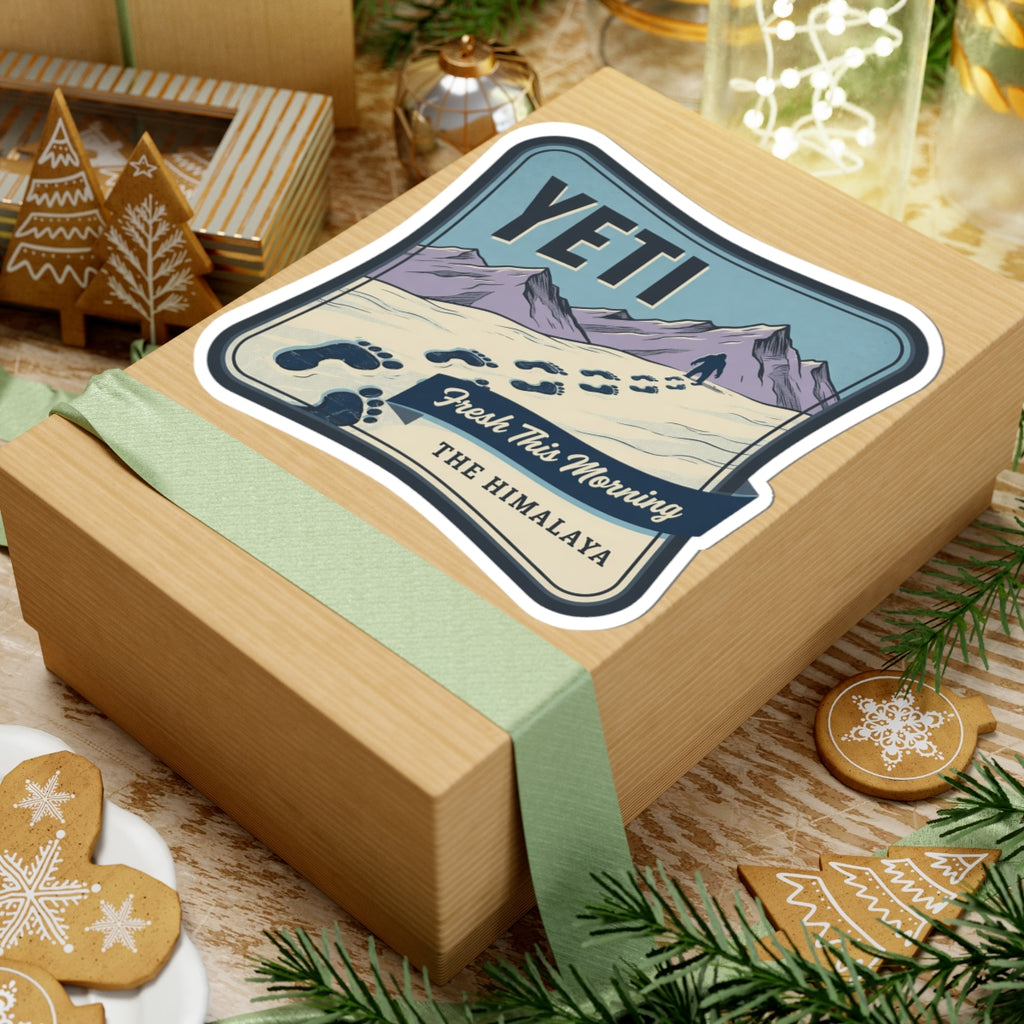 Vinyl sticker on a gift wrap featuring YETI, Himalayan mountains, paw prints, and “The Himalaya”