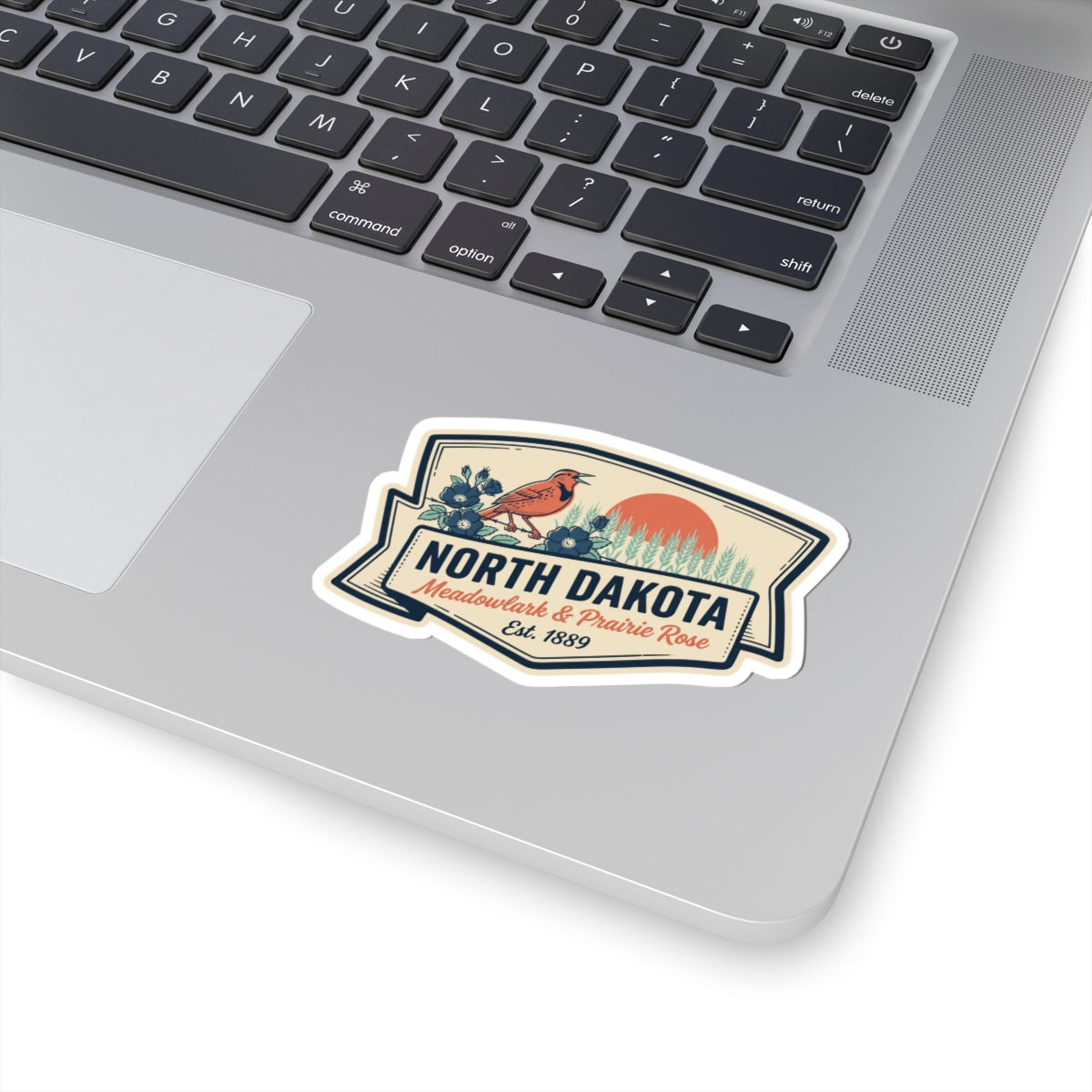 North Dakota kiss-cut vinyl sticker with bird and “Meadowlark & Prairie Rose” lettering on badge