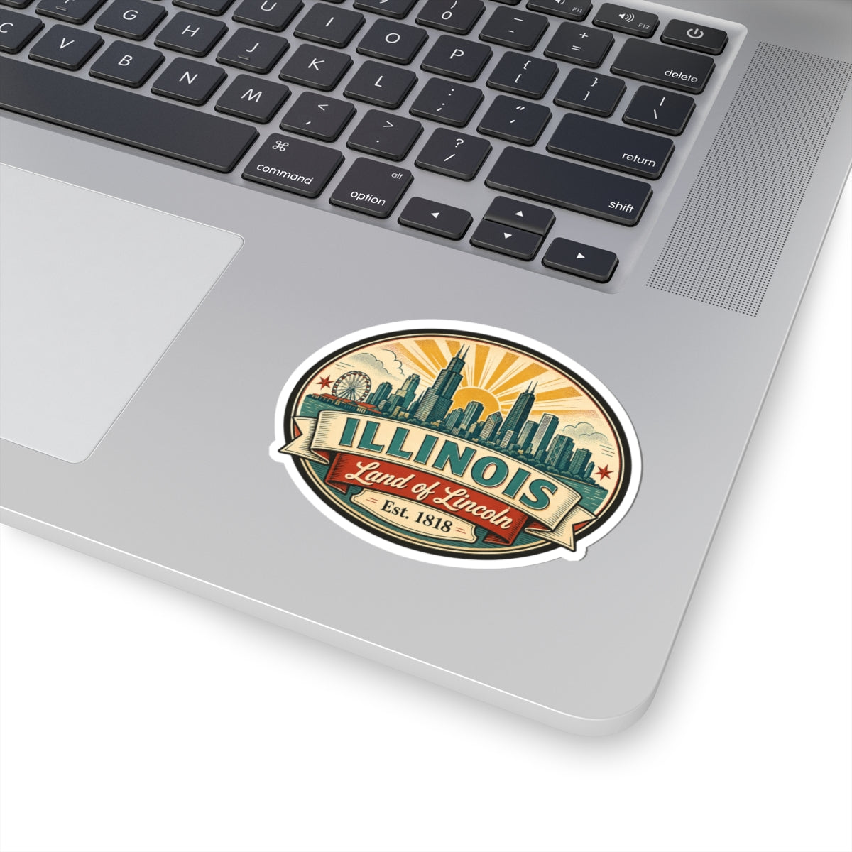 Kiss-cut vinyl decal on a laptop: Illinois skyline, “Land of Lincoln,” “Est. 1818.”