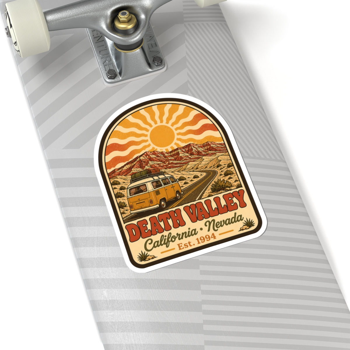 Kiss-cut sticker with yellow vintage camper van, winding road, and Death Valley lettering