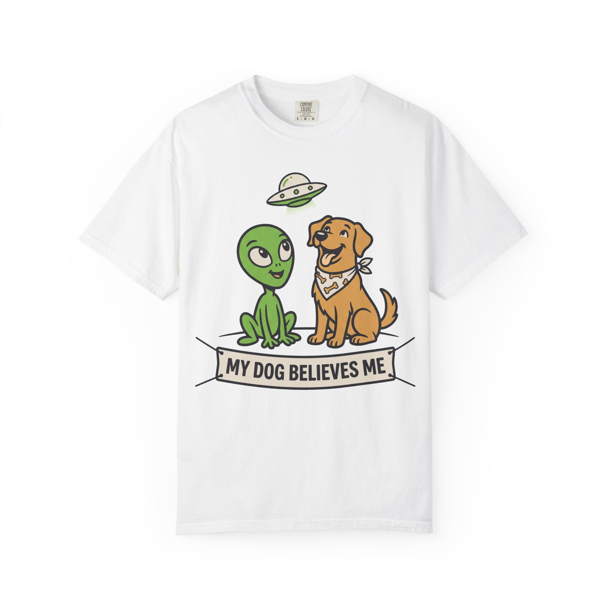 White t-shirt with cartoon alien and dog and "My Dog Believes Me" banner graphic