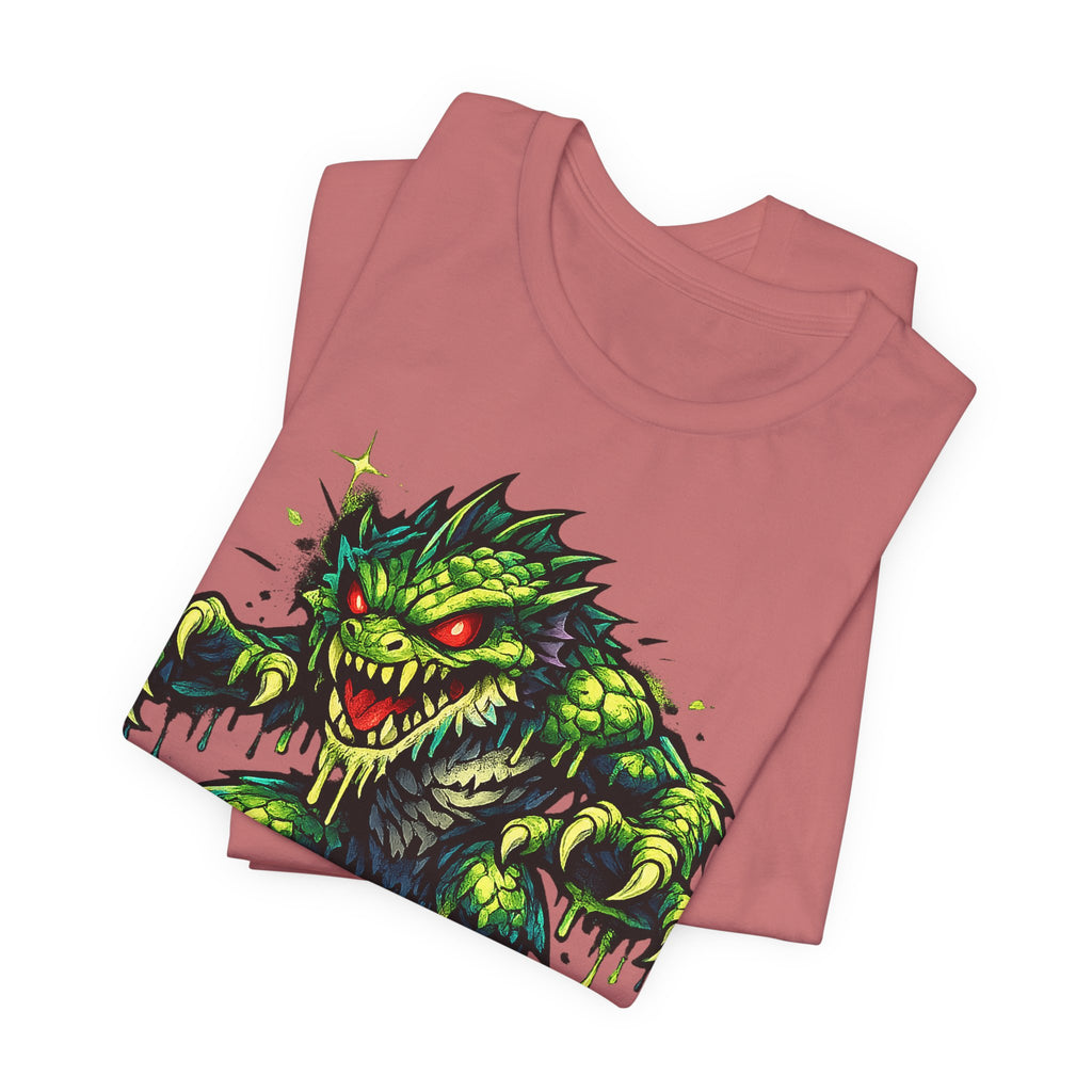 Mauve T-shirt with green swamp monster illustration on front graphic.