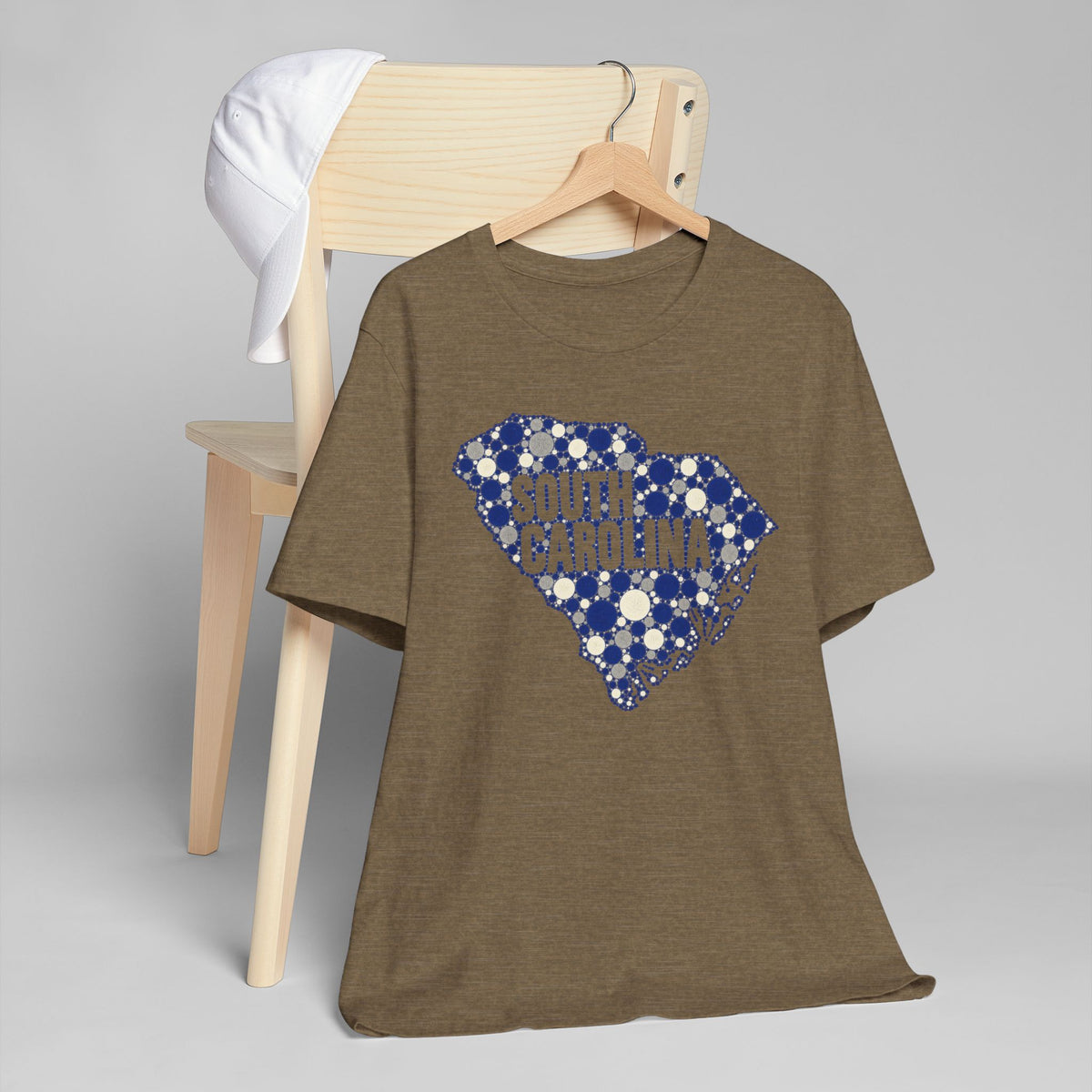 Dark olive-brown t-shirt with blue dotted South Carolina map graphic.