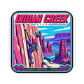 Square sticker with thick outline border, “INDIAN CREEK” title, and climber scene
