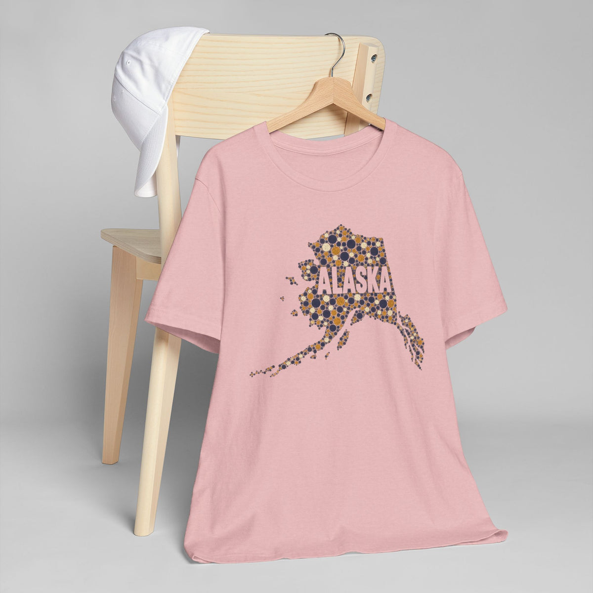 Pink crew-neck T-shirt with dotted Alaska state graphic on the front