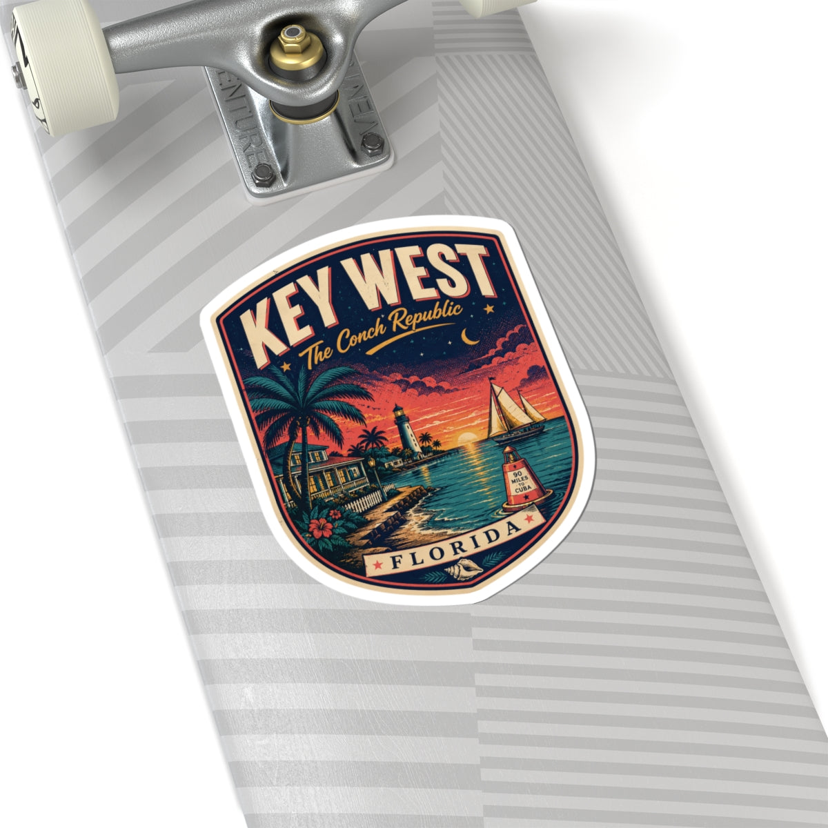 Key West luggage tag sticker on a striped tag, palm sunset harbor with sailboat and 'FLORIDA'