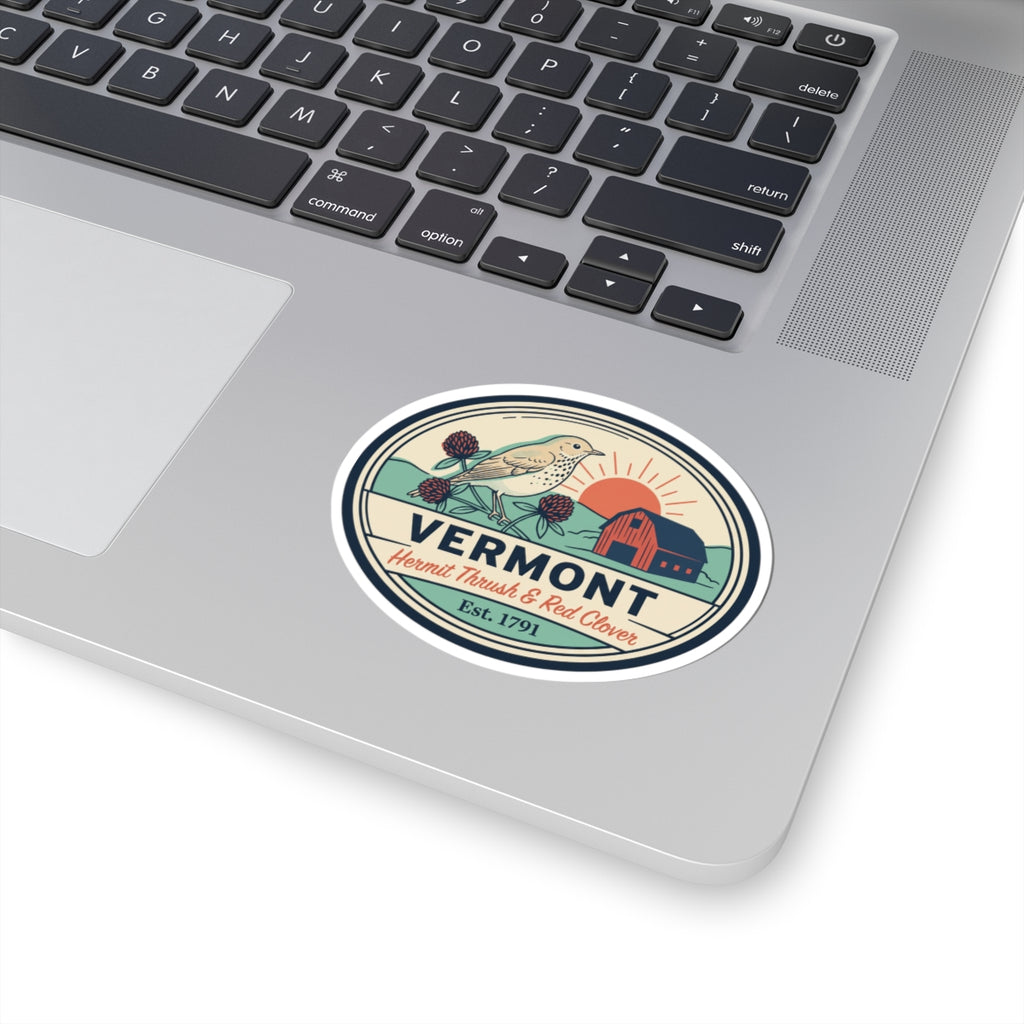 Oval Vermont sticker with hermit thrush, red clover, barn and Est. 1791 on laptop