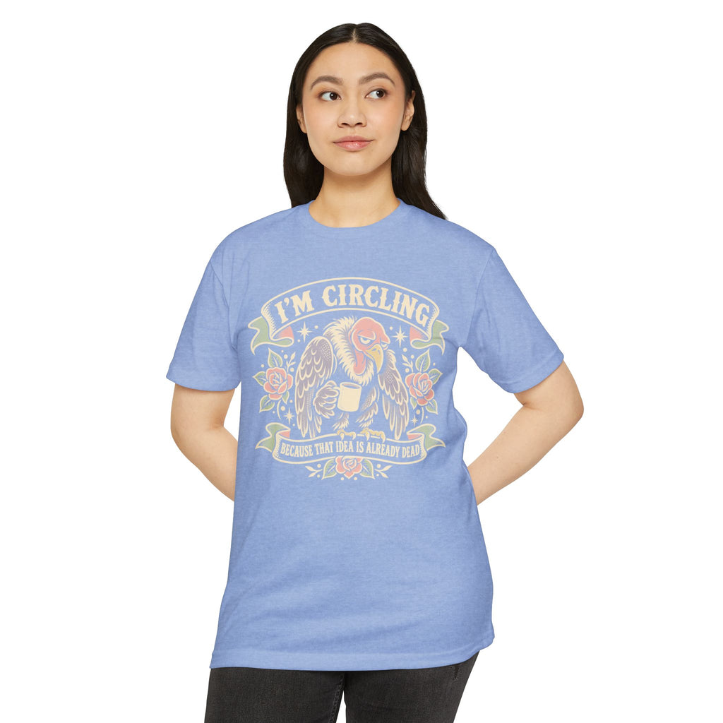 Blue graphic t-shirt with vulture 'I'm Circling' front print, worn by woman