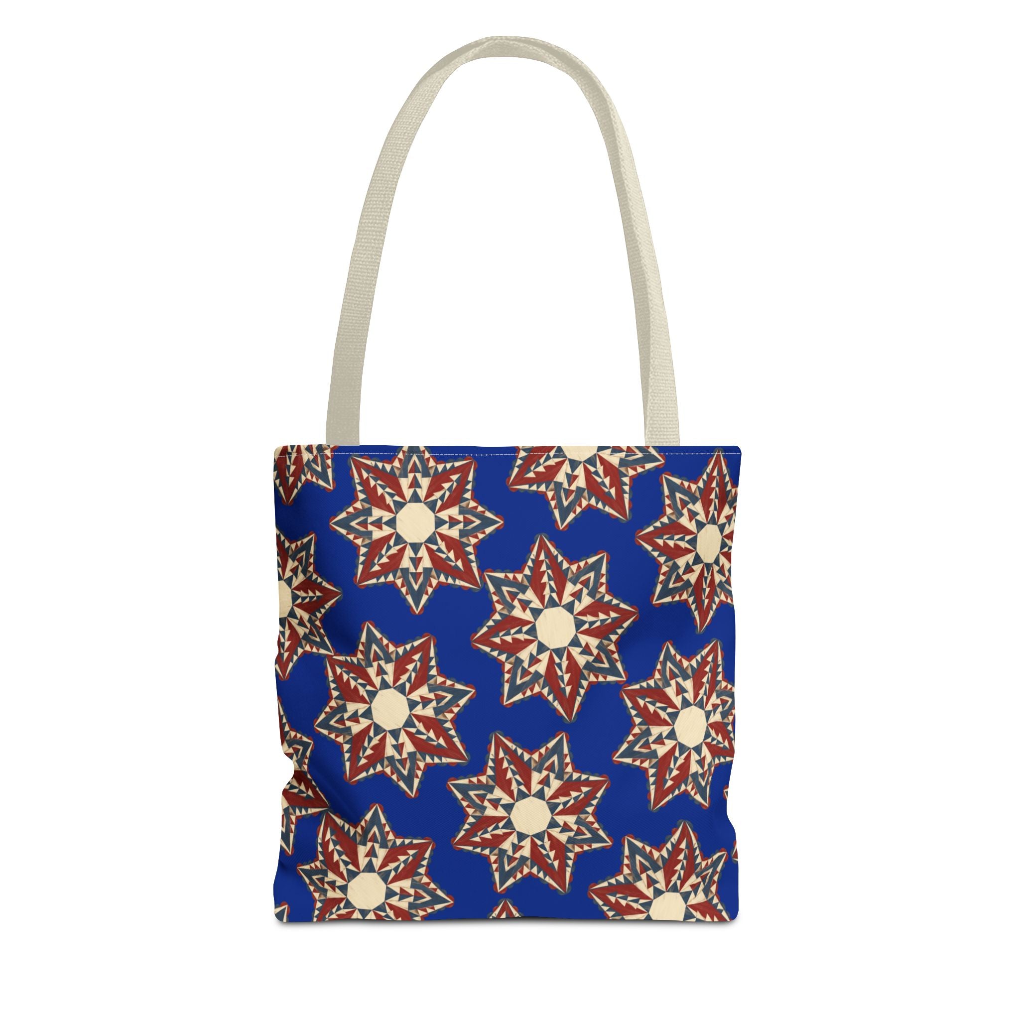 Blue tote bag with starburst floral pattern and beige-gray handles