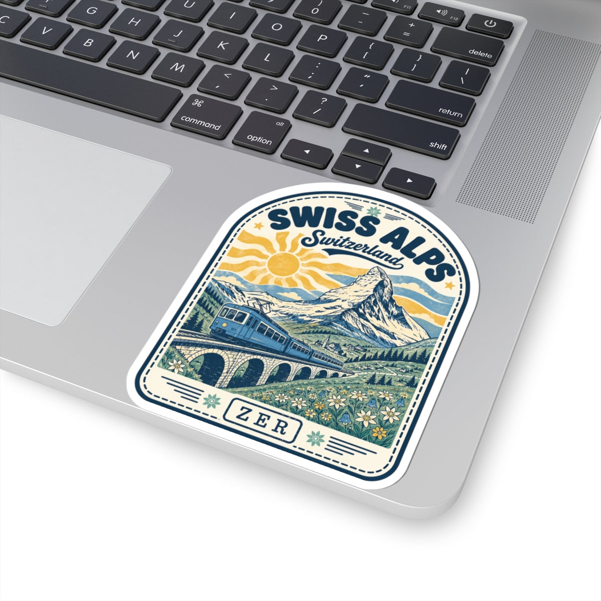 Swiss Alps train mountain sticker on laptop, blue train and mountains with ZER text