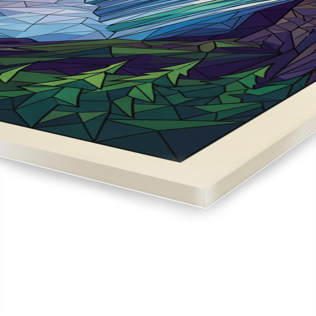 Close-up of acrylic wall art corner edge with geometric blue-green pattern.