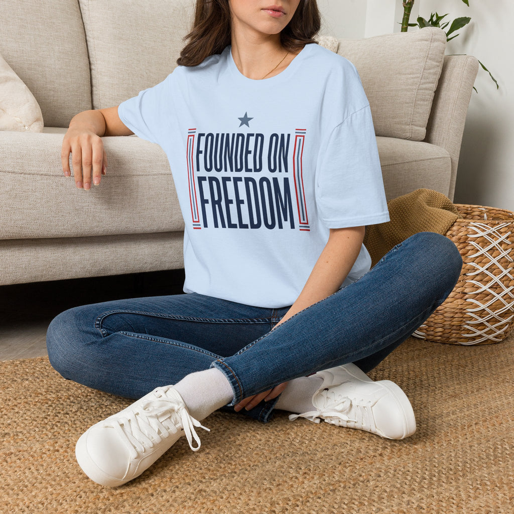 Light blue T-shirt with "Founded on Freedom" patriotic graphic on front