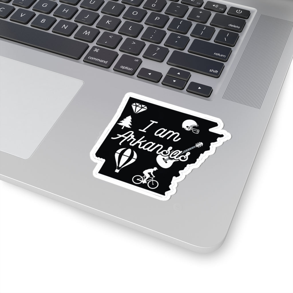 I am Arkansas sticker on laptop, black design with white border and icons