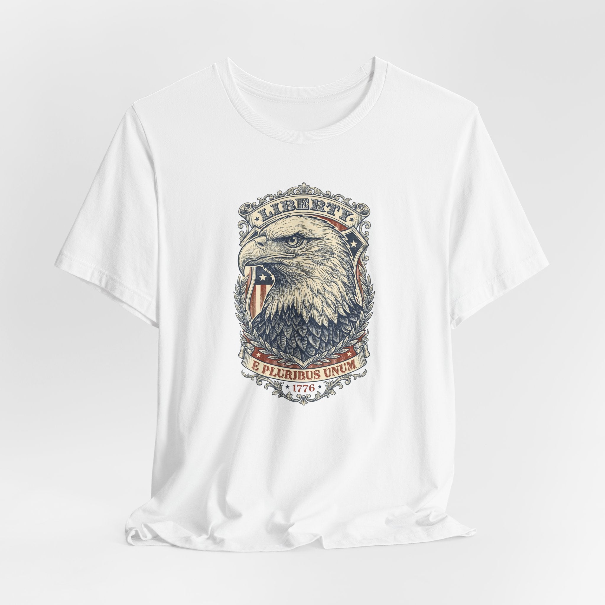 White crew-neck graphic tee with bald eagle head and “Liberty” banner design