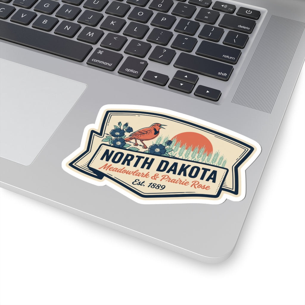 North Dakota kiss-cut vinyl sticker with bordered emblem, orange bird, and prairie rose flowers