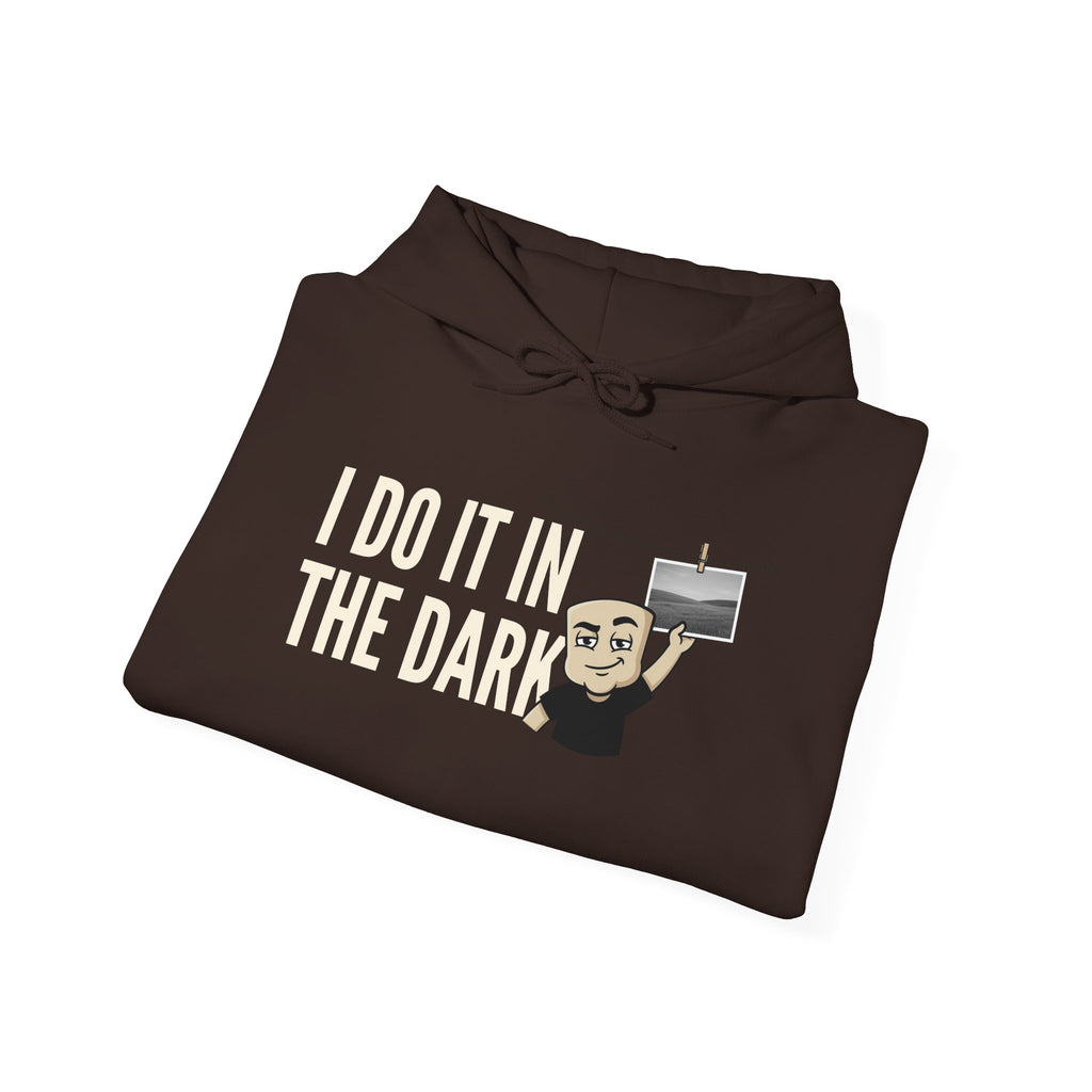 Dark brown hoodie with “I DO IT IN THE DARK” text and cross graphic on front