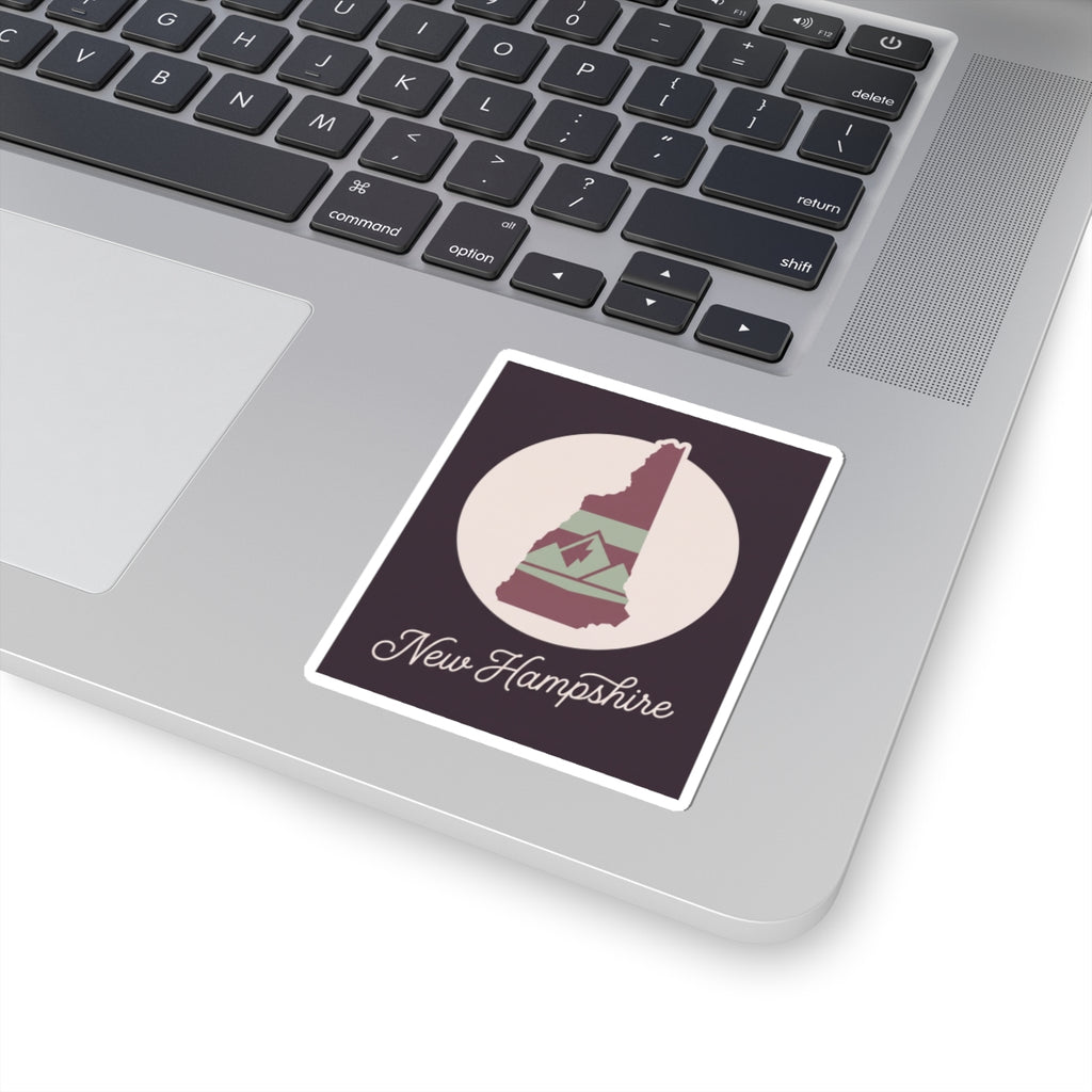 New Hampshire state silhouette kiss-cut decal sticker on a laptop keyboard area