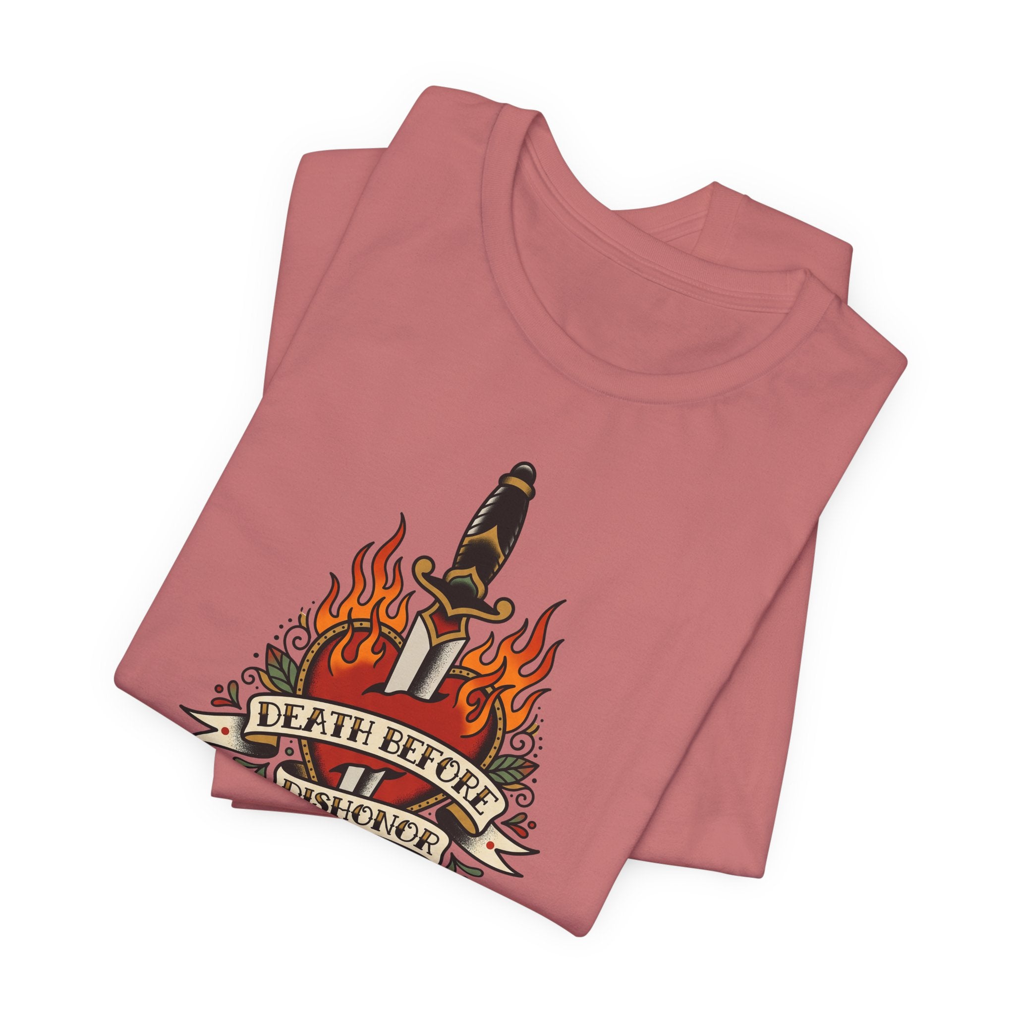 Dusty rose T-shirt with flaming dagger and banner graphic at chest.